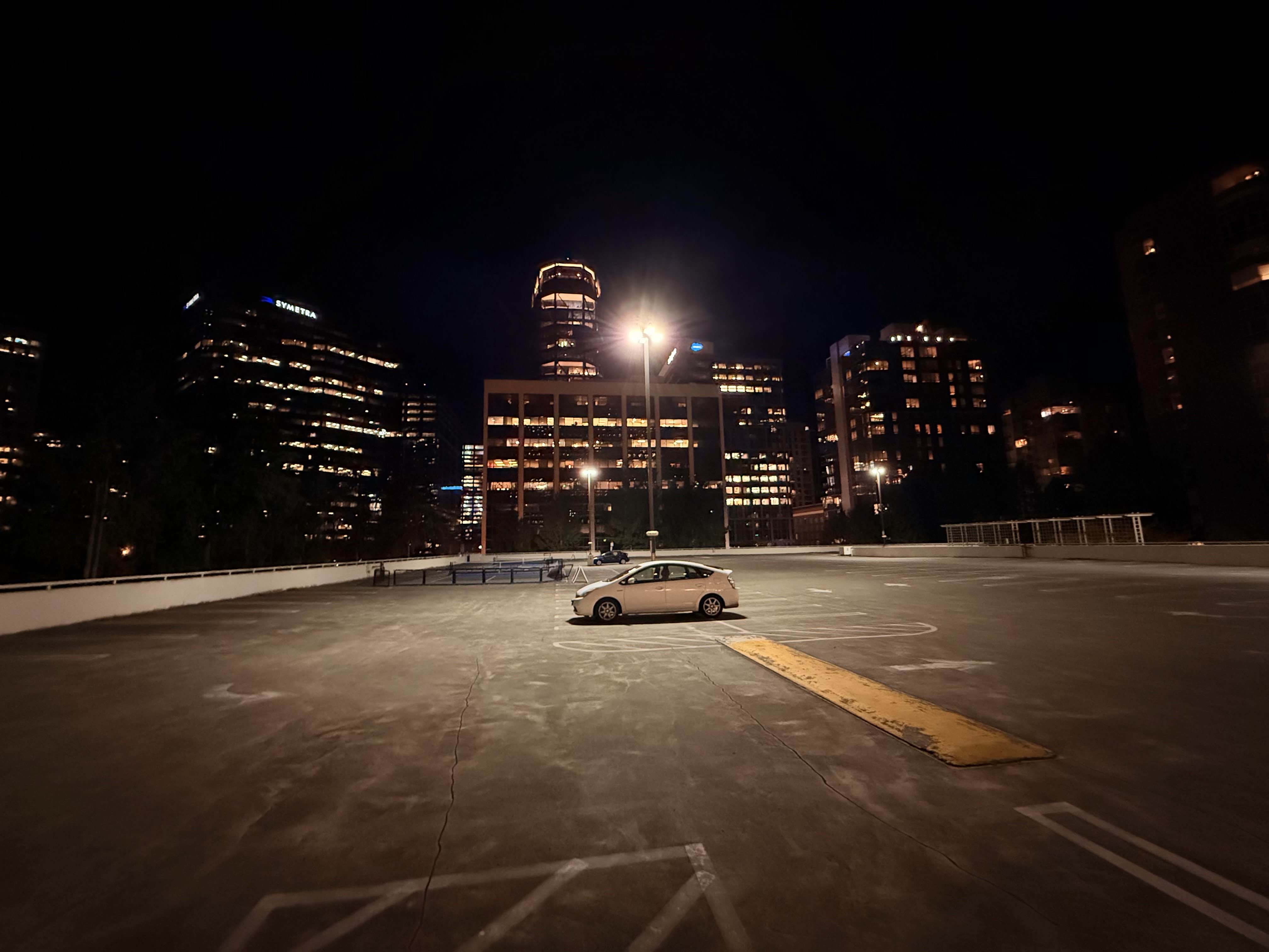 Empty rooftop parking lot at night